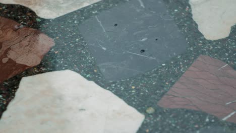 Right-to-left-panning-shot-of-a-colorful-stone-pathway