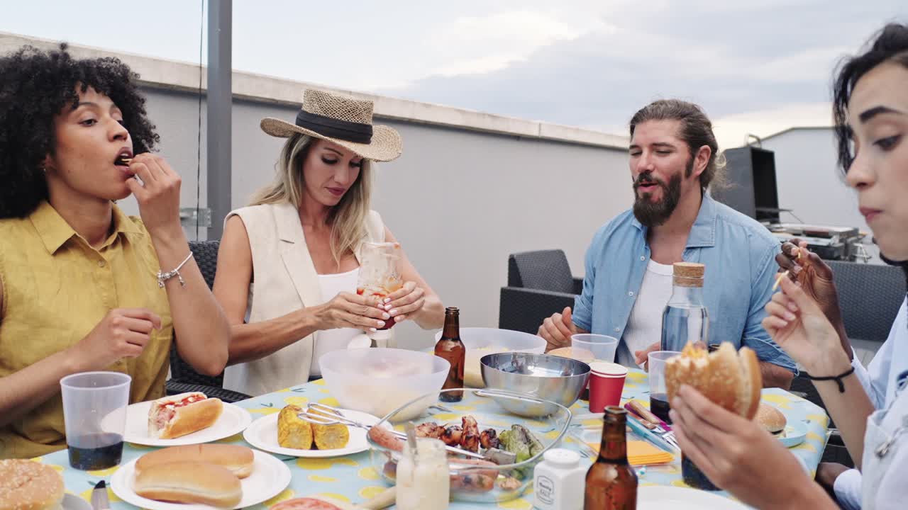 A group of people eating a meal outdoors