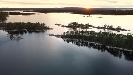 aerial view of swedish nature landscape during orange sunset with a clear sky