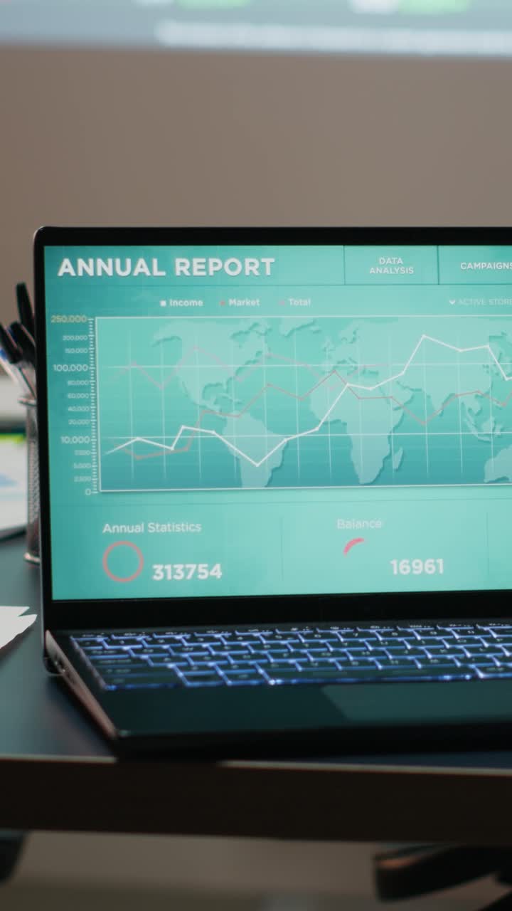 Vertical Video Modern corporate space sits empty after hours with forecasting charts