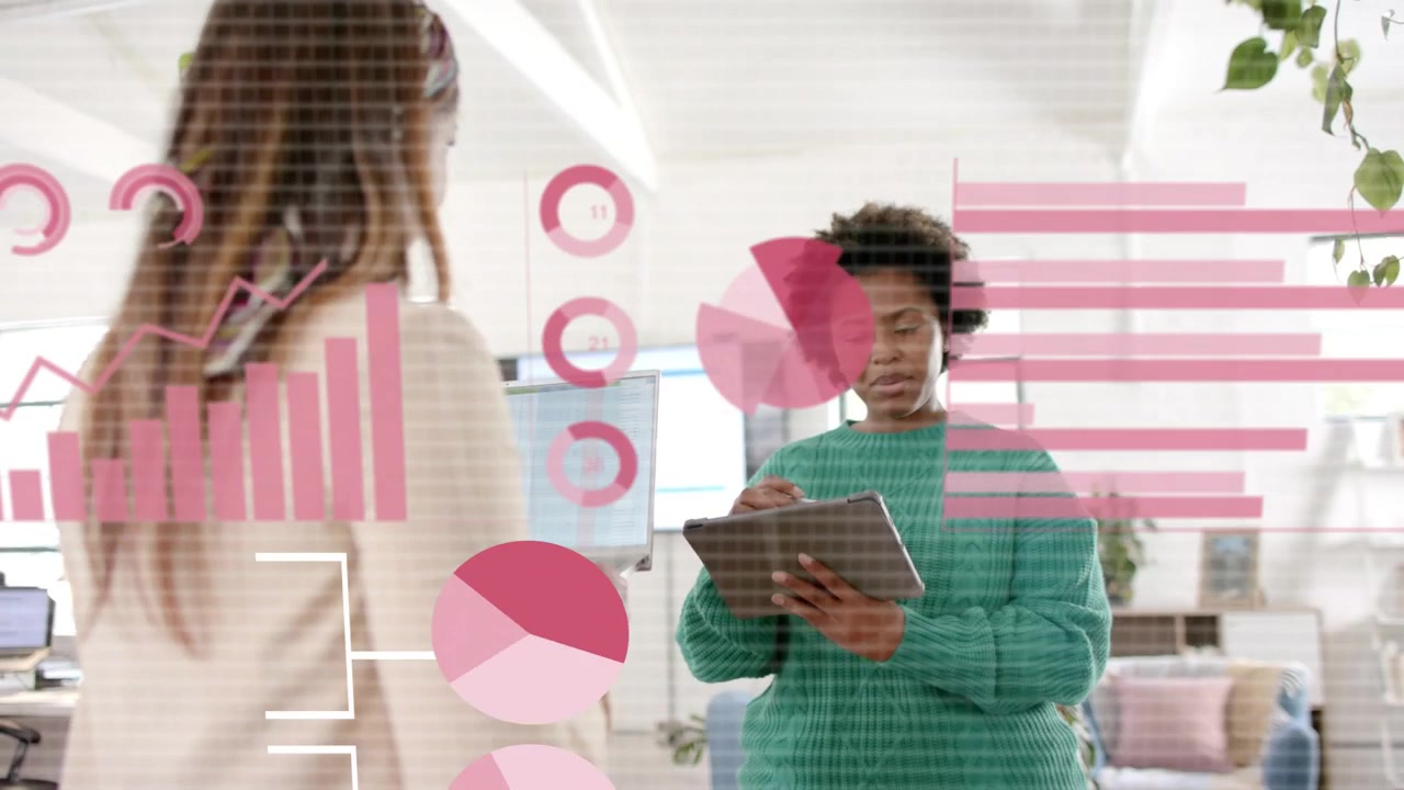 Two colleagues tapping tablet in bright office, summoning data overlays between them for review