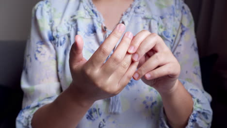 women doing hands stretching and exercising to protect office syndrome and hand arthritis after work at home office day