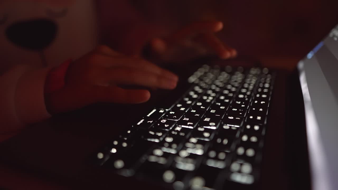 Typing on a laptop in the dark