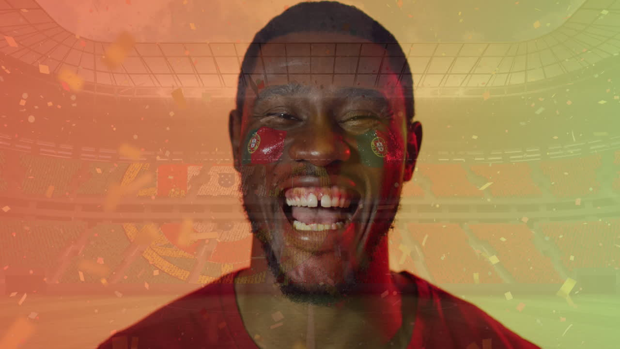 Animation of confetti over smiling african american footballer celebrating and flag of portugal
