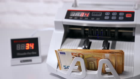 machine for counting money. euros banknotes. finance concept. mechanism for bank financial operations