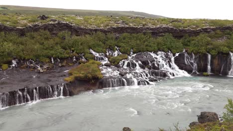 scenic hraunfossar waterfall in iceland - wide shot