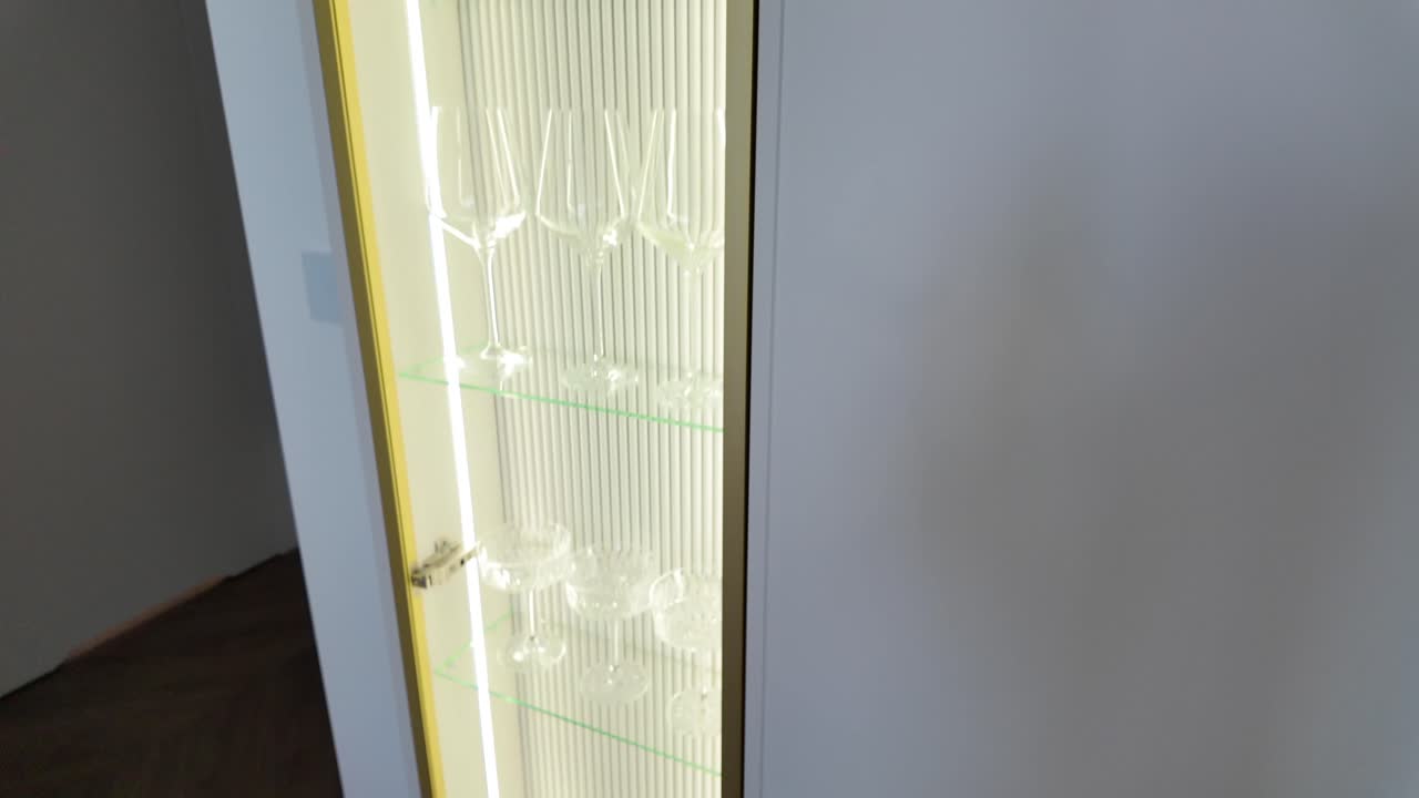 Luxurious floor to ceiling vertical glass and alcohol cabinet