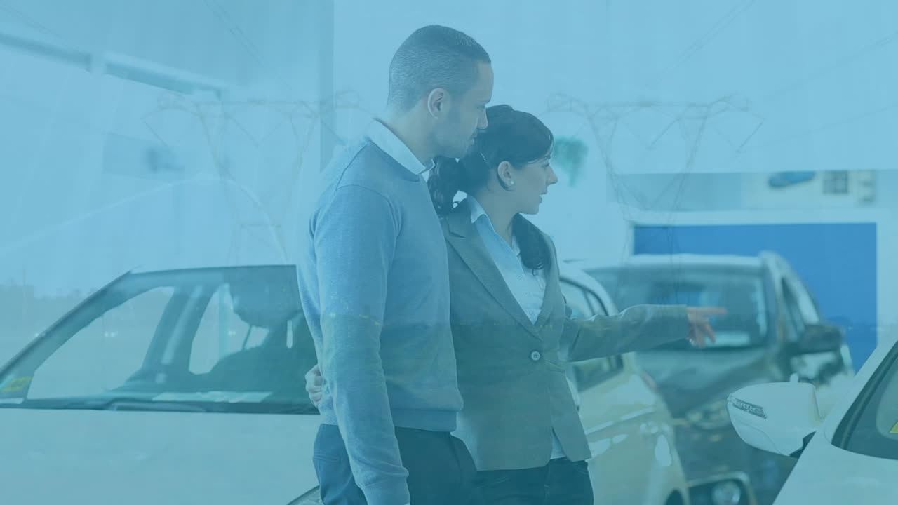 animación de pilares sobre pareja caucásica en el salón de automóviles.