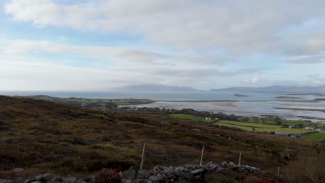 aerial: flying above ground on croagh patrick and famous clew bay in ireland