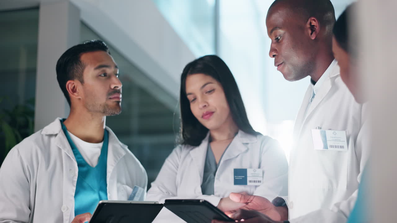 Hospital, doctors and men and women on tablet