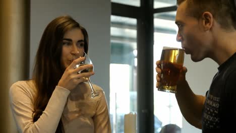 smiling couple having a drink together