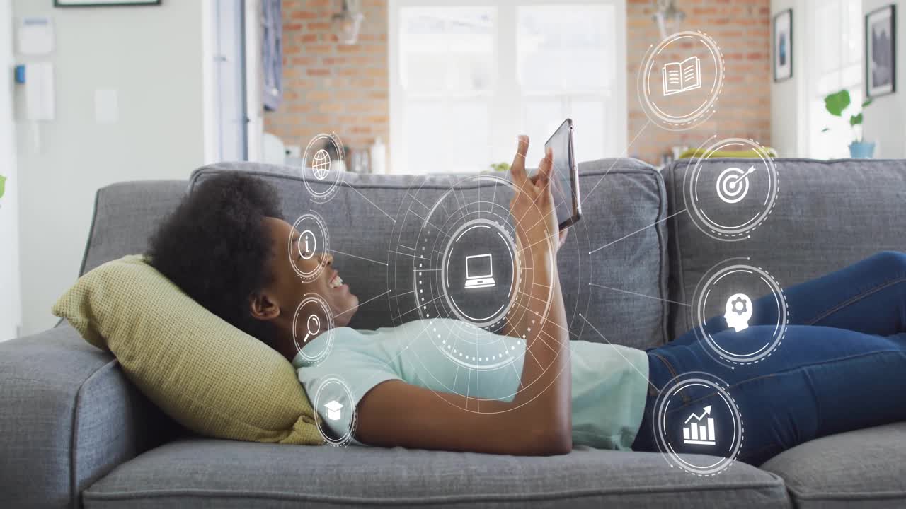 Teenage girl tapping tablet and swiping holographic icons for exploring futuristic educational app