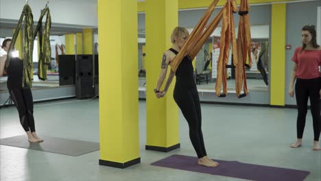 aerial yoga class in a gym