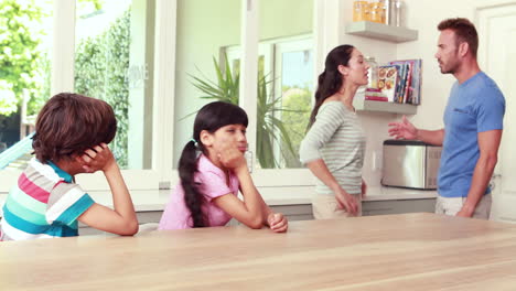 couple arguing in front of children