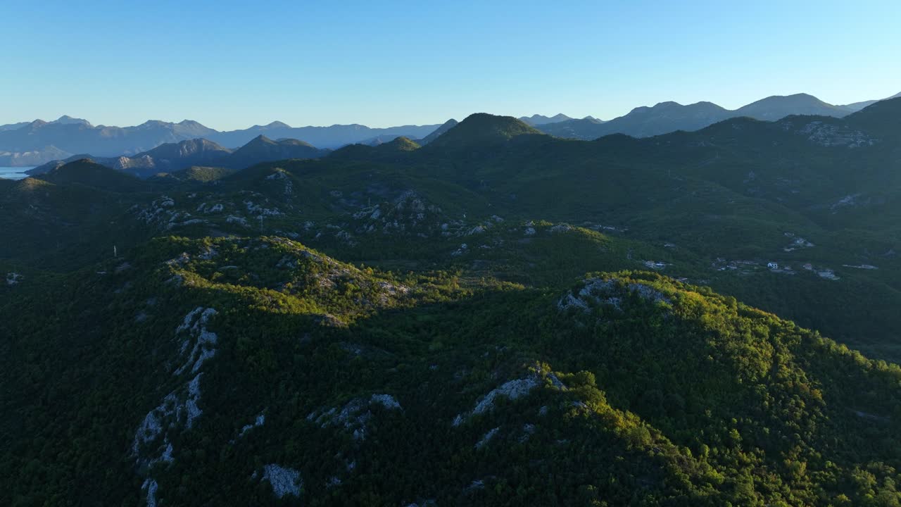 Golden Light Sweeps Over the Rugged Hills Near Skadar Lake, Not Far From the Village of Virpazar in Montenegro - Orbit Drone Shot