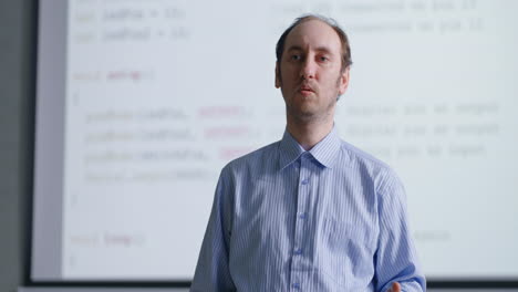 man giving a presentation in a classroom