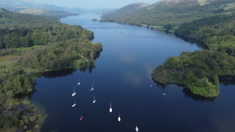 drone footage showing coniston lake in the lake district, cumbria, uk and looking north from the south of the lake