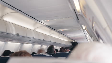 airplane cabin interior with passengers