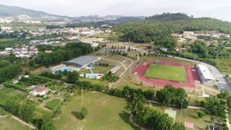 flying over sports complex in city