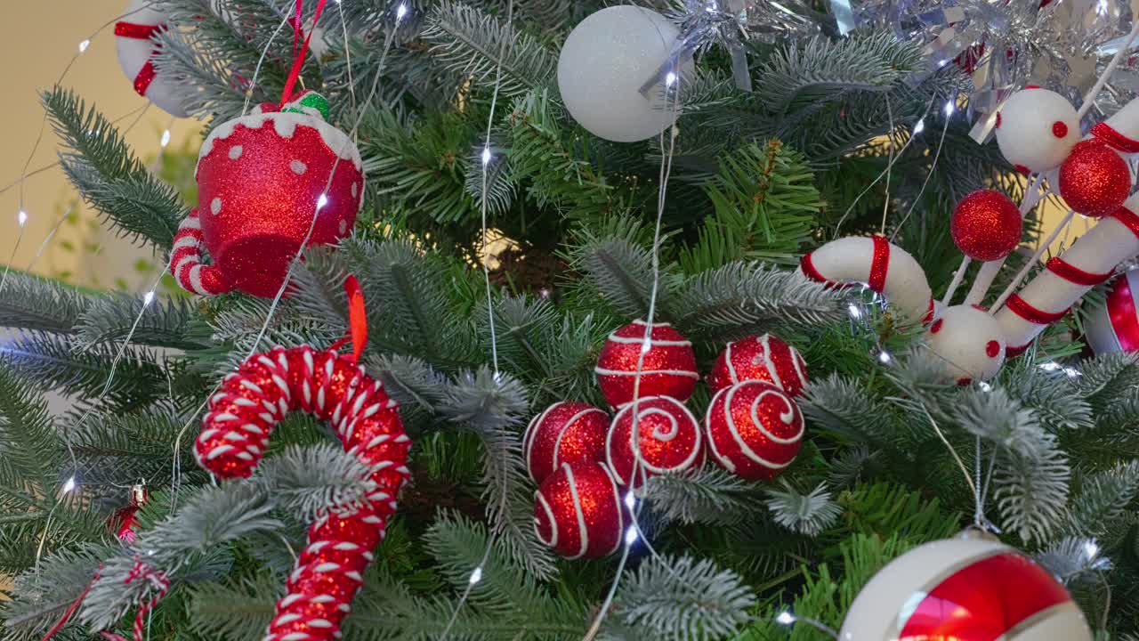 Christmas tree with fairy lights and trimmings. Decorations and balls with festive concept. Merry Christmas