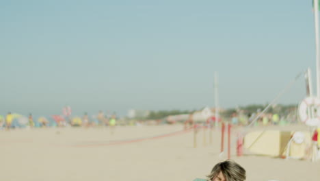 Tracking-shot-of-boy-hitting-soccer-ball-and-falling-to-ground