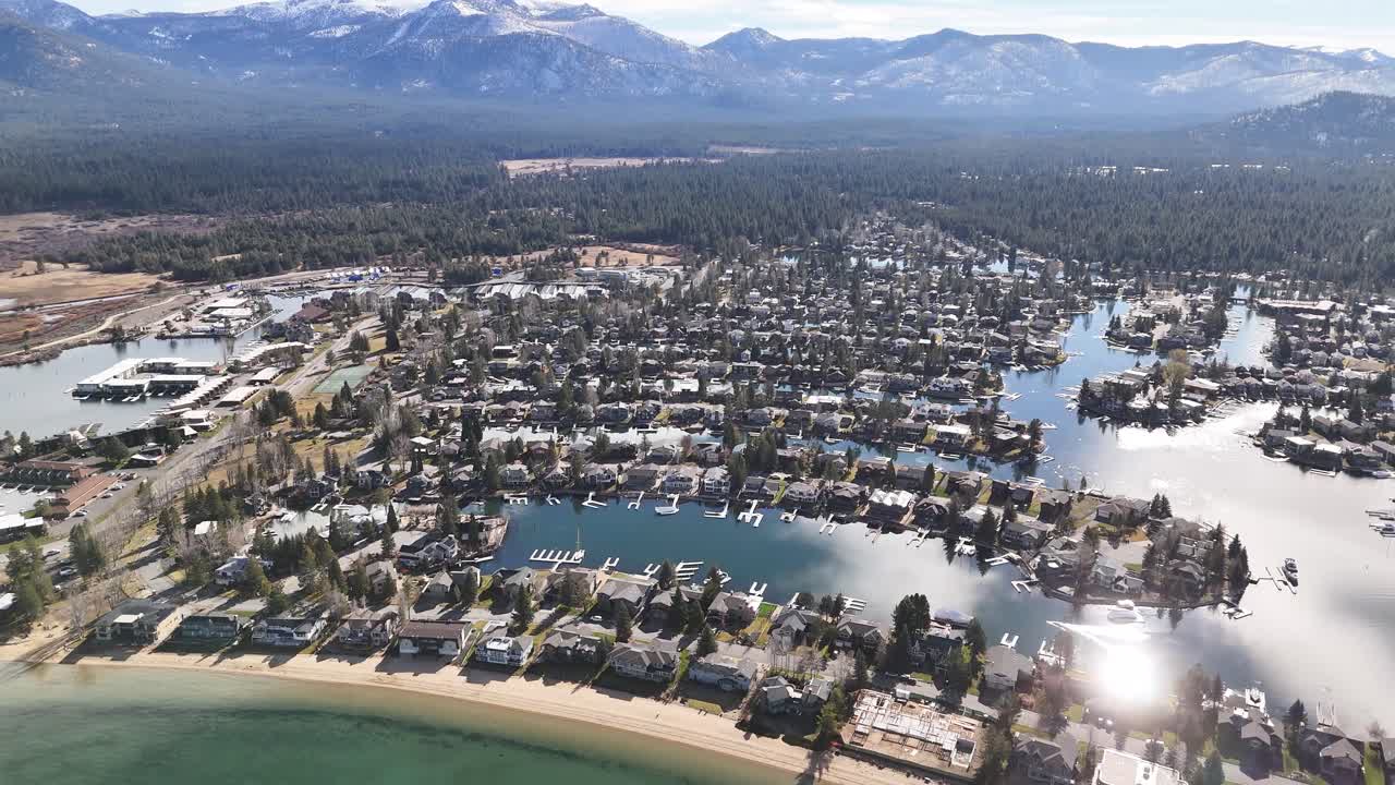 Title Aerial view of Lake Valley residential community with pond and pine forest