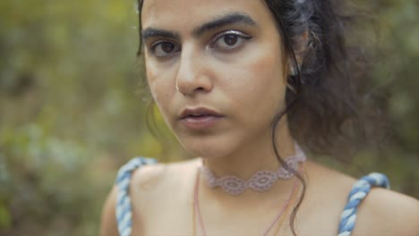Cinematic-slow-motion-close-up-shot-of-a-fashion-model-face-in-the-tropical-rain-forest-of-Goa,-India,-Black-Hair