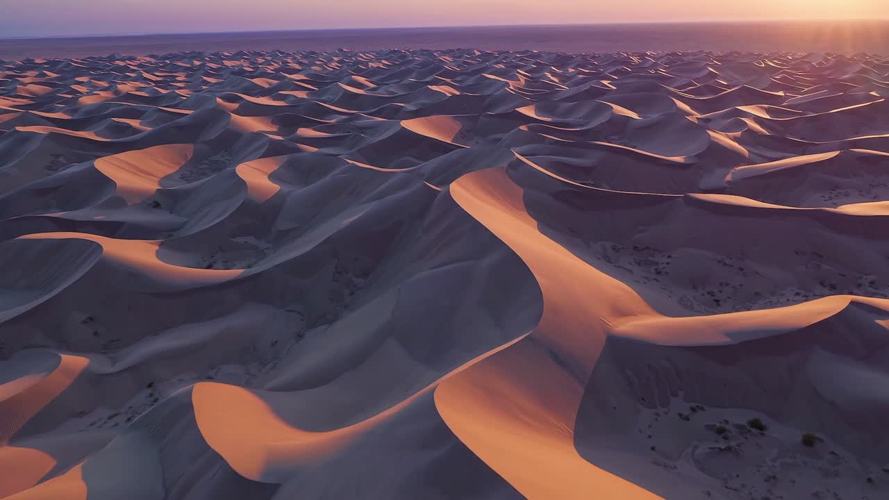 CGI aerial drone footage of Death Valley National Park at sunrise, capturing the breathtaking beauty of the sand dunes and the desert landscape.