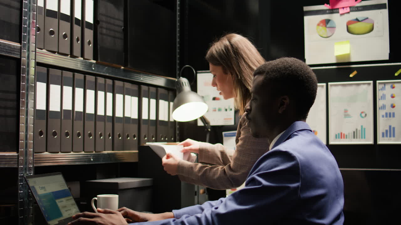 Office Workers Analyzing Data in a Storage Room