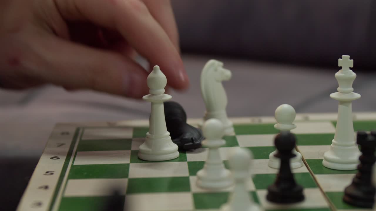 Close-up Hand Playing Chess Indoor.