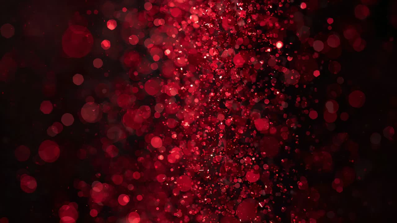 Colonna di particelle rosse densa, luminosa e scintillante in studio, attivata dallo spostamento della messa a fuoco con effetto bokeh