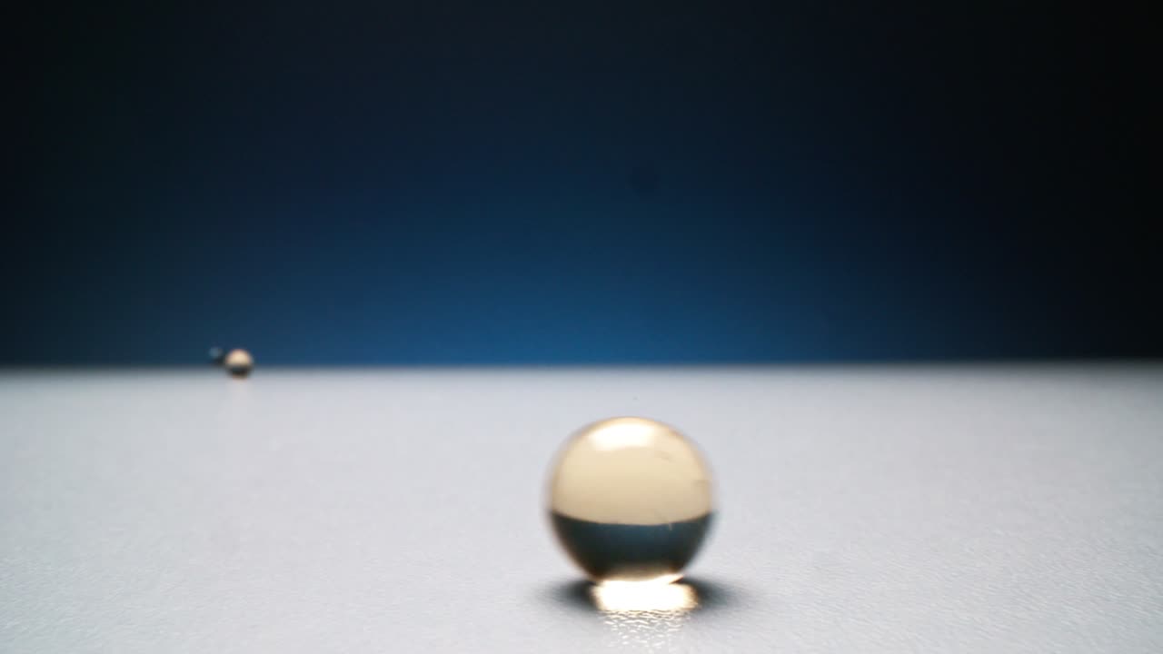 Pouring From Above Gold Hydrogel Capsules