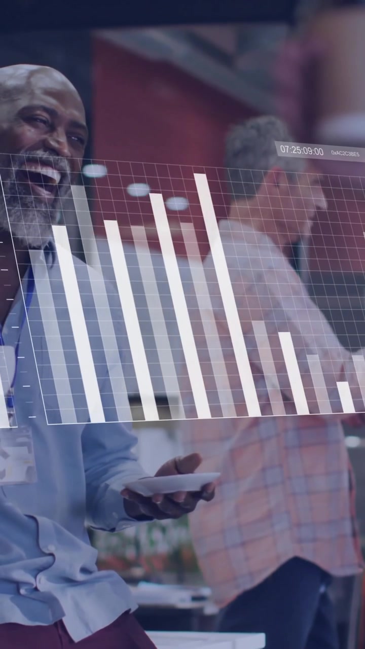 Business data charts animation over diverse professionals collaborating in modern office