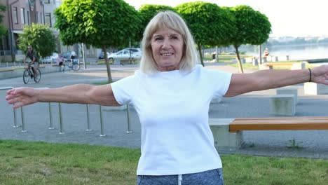senior woman exercising outdoors in a park