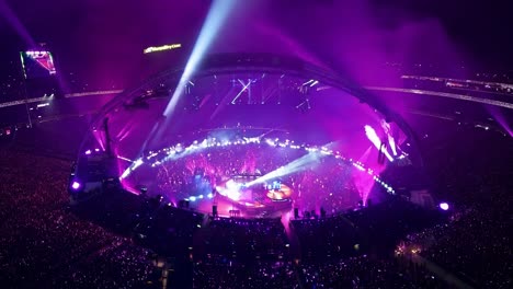 a large crowd at a concert in a stadium