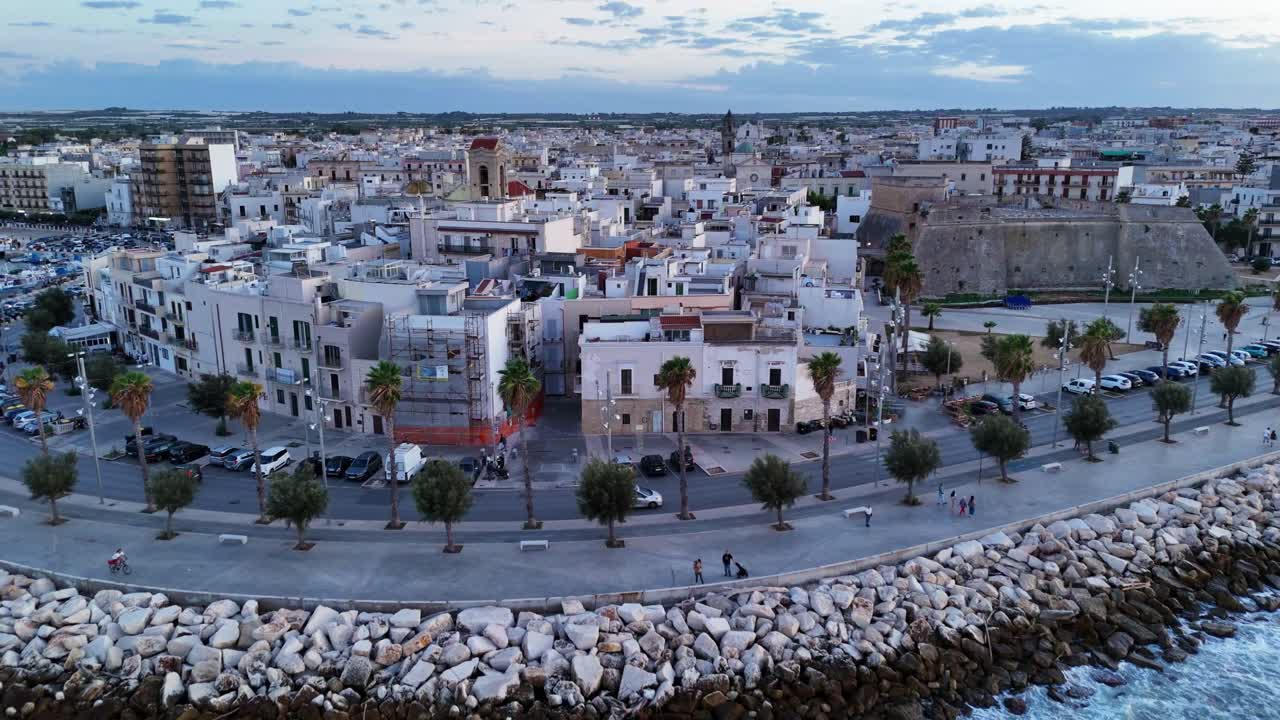 Mola di Bari cityscape and rough sea, aerial drone view