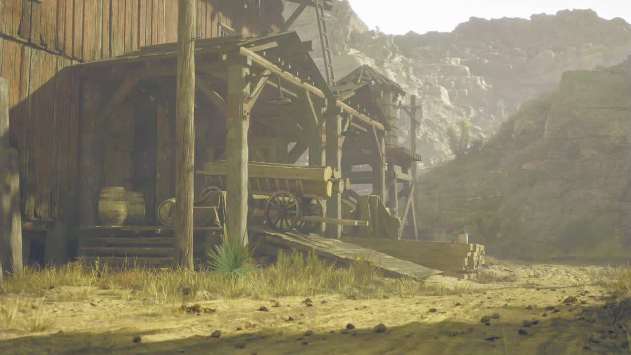 Old wooden structures alongside a dusty road in a rugged landscape