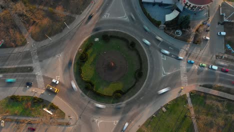 4k aerial view timelapse of roundabout road with circular cars.