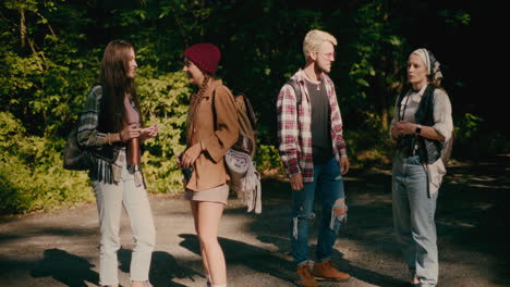 young tourists friends talking to each other on footpath