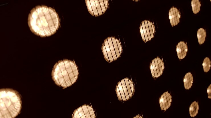 Close-up of multiple warm-toned spotlights