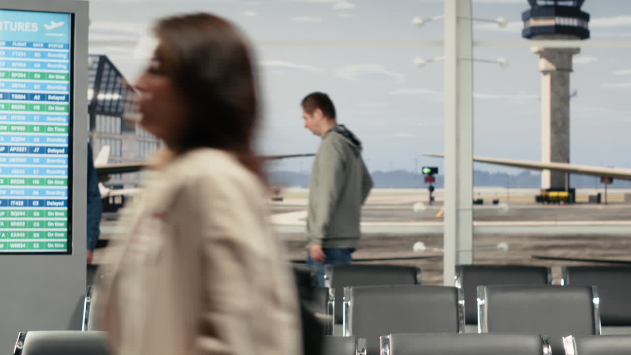 Multiethnic crowd walks toward airport departure gate during global voyage
