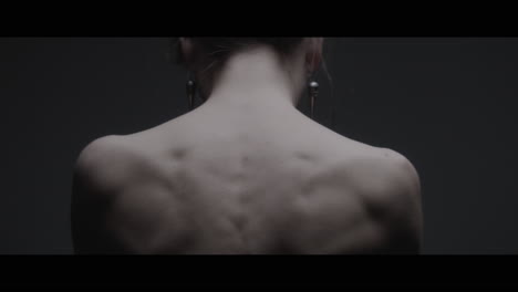 a woman dressed as mother nature shows her back
