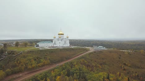 orthodox monastery on a hilltop in autumn