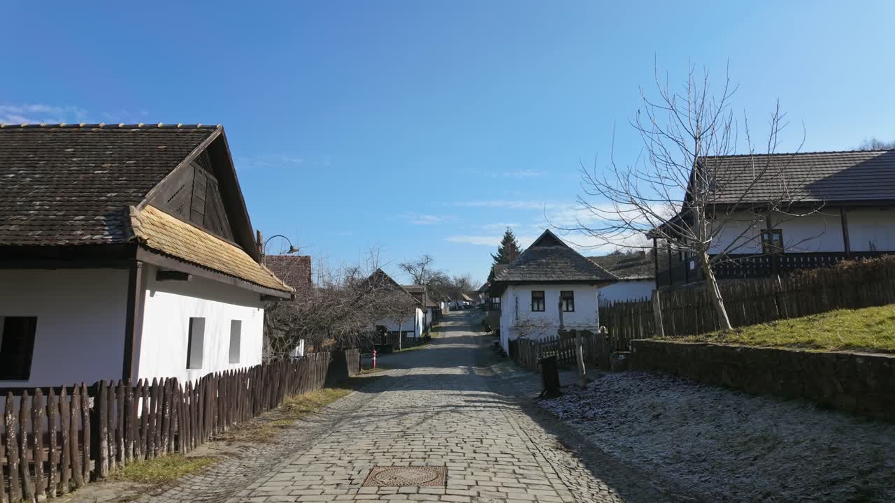 Idyllic street view from the preserved old town of Holloko on a sunny winter day in Hungary.