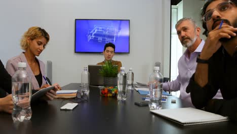 business colleagues sitting in meeting 4k