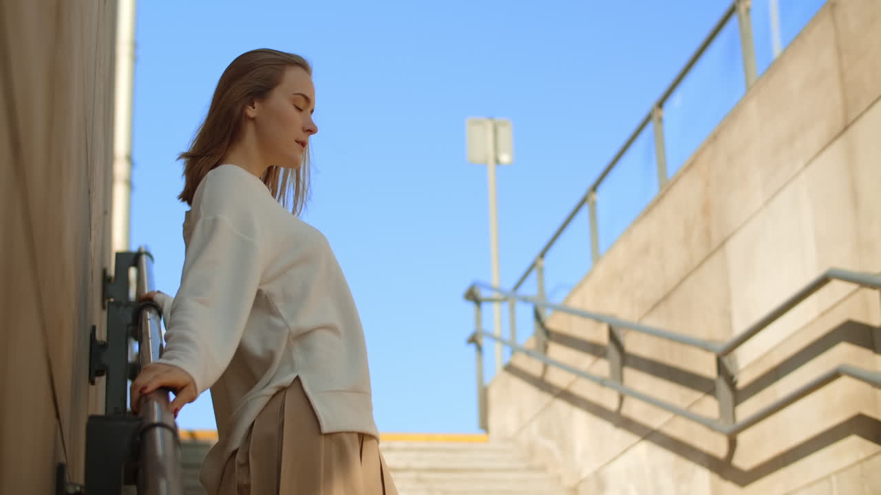 Young Woman Posing on City Stairs