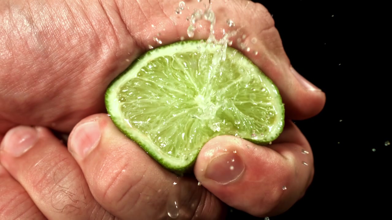 Fresh Lime Slice with Water Splashing in Slow Motion