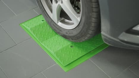 car wheel on green platform