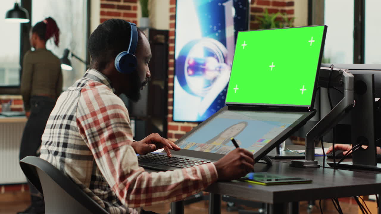 Young content creator using greenscreen background on computer