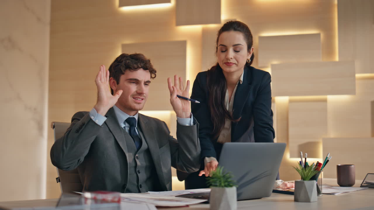 Stressed business partners working at cabinet closeup. Frustrated boss typing